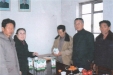 don-kim-joo-bringing-insecticide-to-daean-dairy-farm-mr-ho-farm-manager-reading-instruction-april-1997